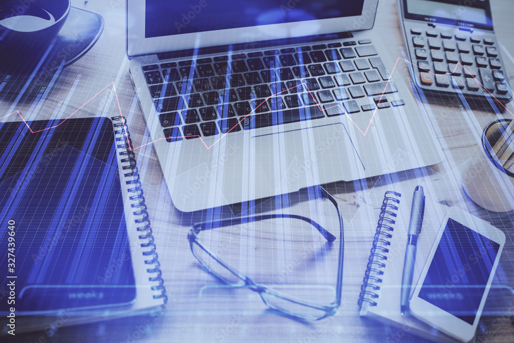 Double exposure of chart and financial info and work space with computer background. Concept of international online trading. Double exposure of chart and financial info and work space with computer background. Concept of international online trading.
