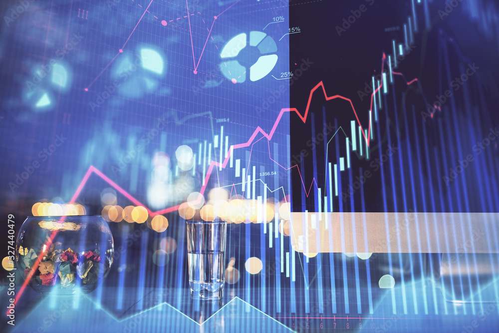 Financial market graph hologram and personal computer on background. Multi exposure. Concept of forex. Financial market graph hologram and personal computer on background. Multi exposure. Concept of forex.