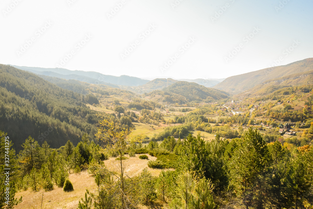 Early morning view on landscape of Mokra Gora near the Zlatibor mountain in central Serbia during autumn taken from the resting spot of Sargan eight train station and tourist attraction in Serbia