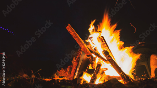 raging campfire in a field 