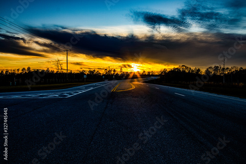 Overpass leading into a sunset.