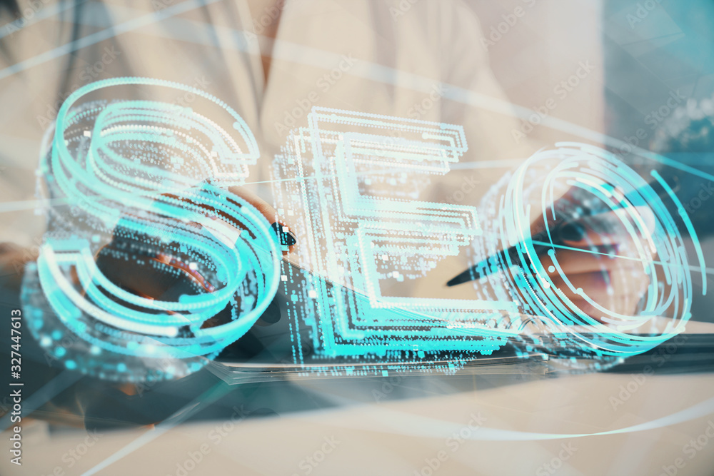 Multi exposure of woman's hands making notes with SEO icon. Concept of Search engine optimization Multi exposure of woman's hands making notes with SEO icon. Concept of Search engine optimization