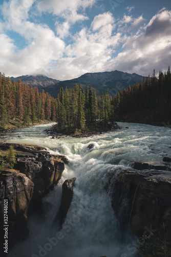 Beautiful Sunwapta Waterfall in Jasper National Park in the Canadian Rockies with converging rivers