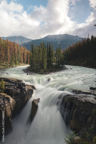 Beautiful Sunwapta Waterfall in Jasper National Park in the Canadian Rockies with converging rivers