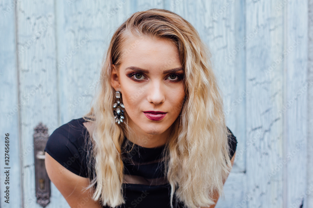 Fototapeta premium Attractive lady with blond hair and bright makeup