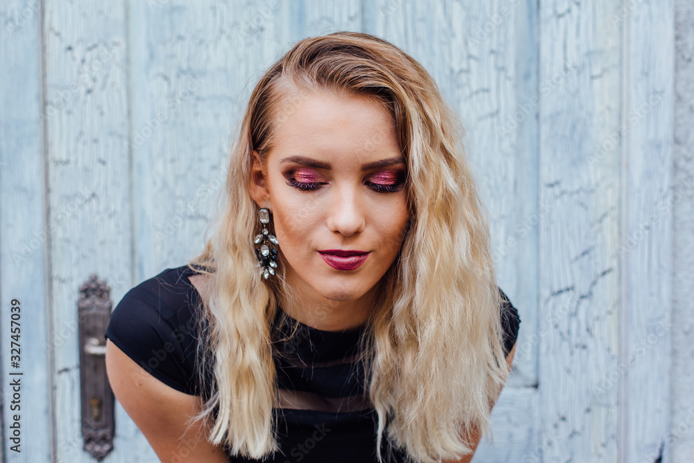 Fototapeta premium Attractive lady with blond hair and bright makeup