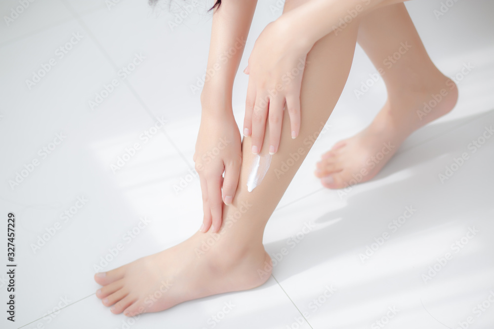 Beautiful asian woman touch skin leg smooth with cream and lotion for hydration and smooth, girl applying body care and cosmetic for silky and soft, beauty perfect with wellness, health and care. Beautiful asian woman touch skin leg smooth with cream and lotion for hydration and smooth, girl applying body care and cosmetic for silky and soft, beauty perfect with wellness, health and care.