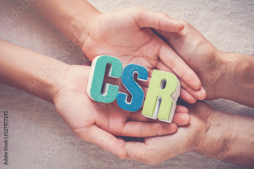 Hands holding CSR corporate social responsibility, business concept