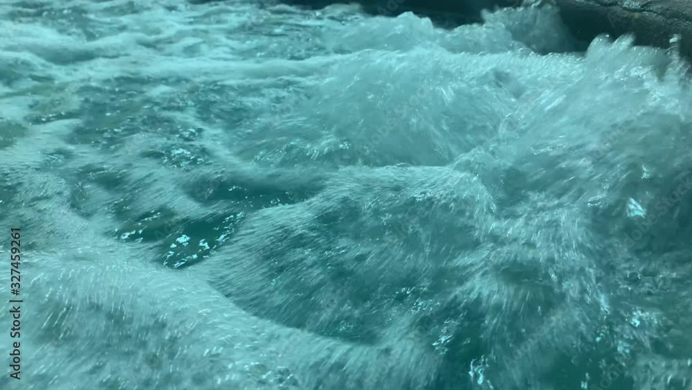 Water level view of bubbling turbulent hot tub surface