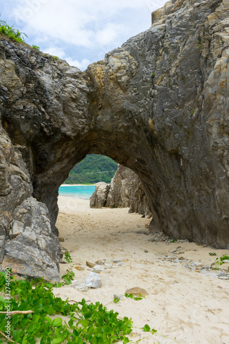natural stone arch on Tokashiki island, Okinawa, Japan. © bennnn
