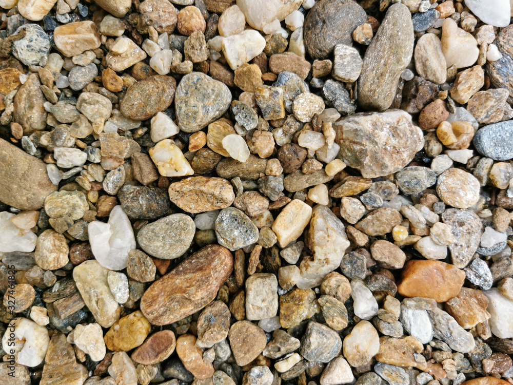 Top view of Pebbles texture background. River stones landscape Top view of Pebbles texture background. River stones landscape