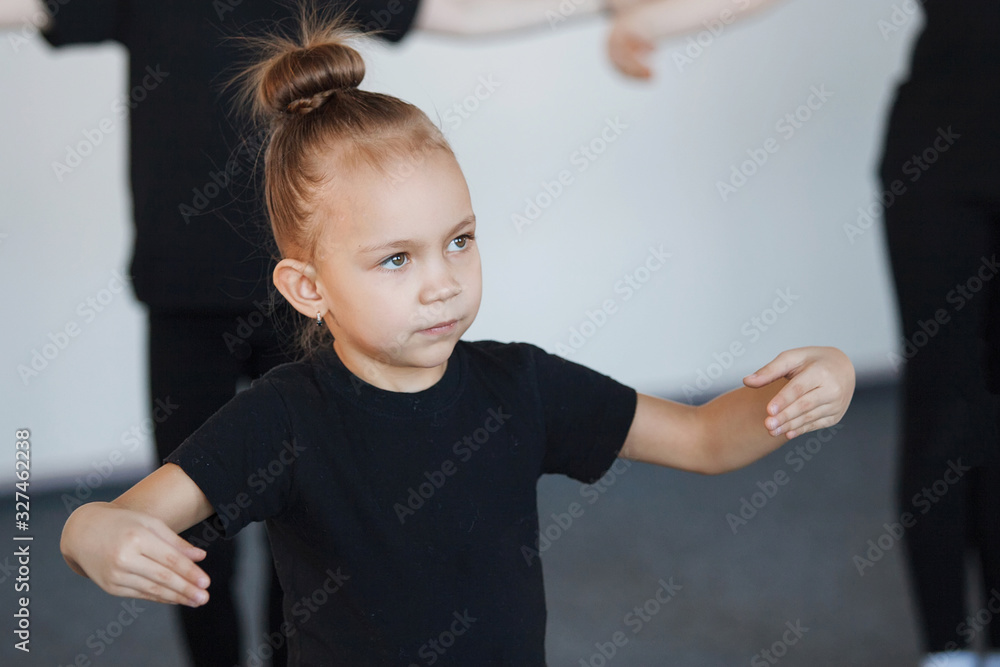 Girls in black leotards posing in dance. Girls in black leotards posing in dance.