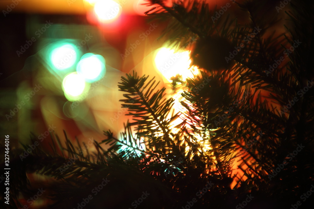 Chrystmas background. Fir-tree and lights