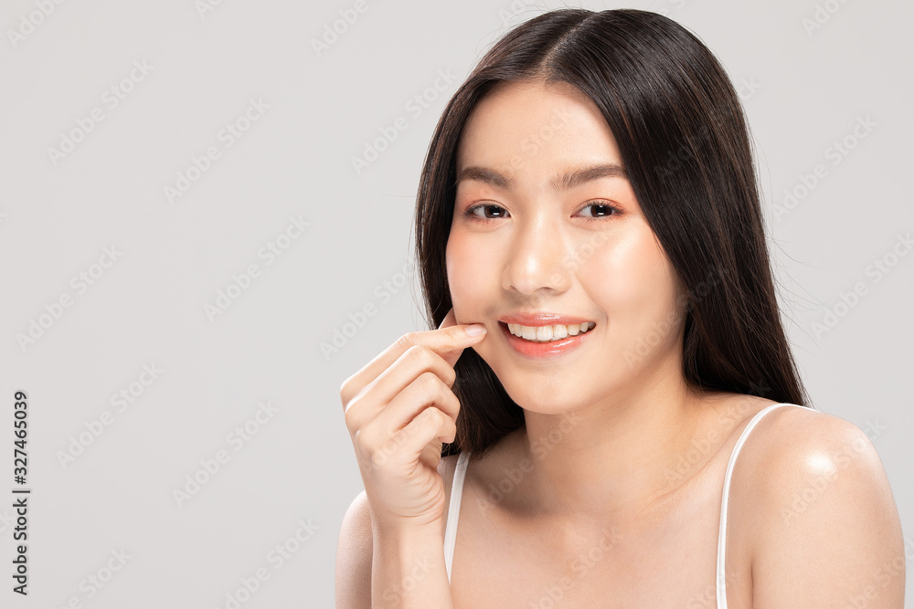 Beautiful Asian woman touching soft cheek smile with clean and fresh skin Happiness and cheerful with positive emotional,isolated on white background,Beauty and Cosmetics Concept Beautiful Asian woman touching soft cheek smile with clean and fresh skin Happiness and cheerful with positive emotional,isolated on white background,Beauty and Cosmetics Concept