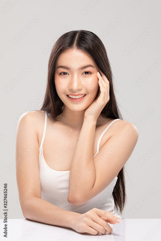 Beautiful Asian woman touching soft cheek smile with clean and fresh skin Happiness and cheerful with positive emotional,isolated on white background,Beauty and Cosmetics Concept Beautiful Asian woman touching soft cheek smile with clean and fresh skin Happiness and cheerful with positive emotional,isolated on white background,Beauty and Cosmetics Concept