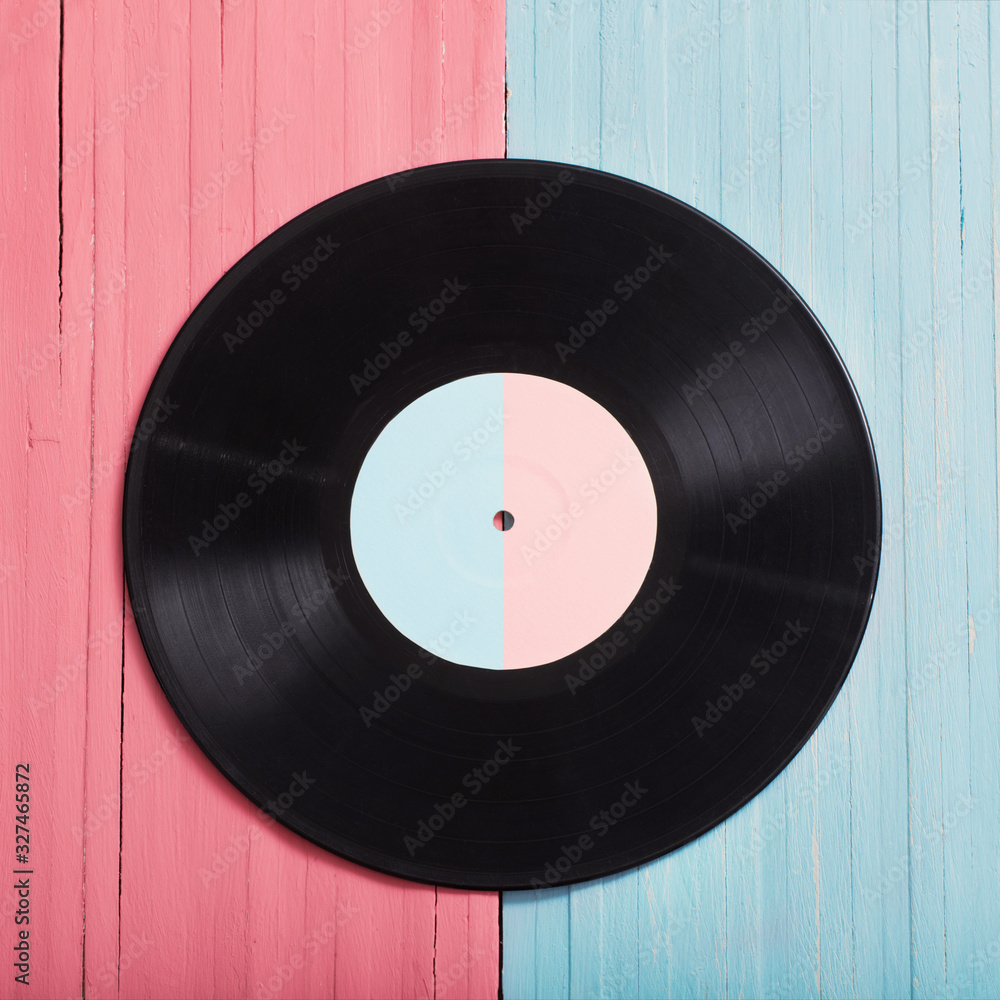 Music records on pink and blue wooden background. Retro music concept - obrazy, fototapety, plakaty 
