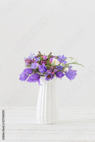 bouquet of spring violet flowers on white background
