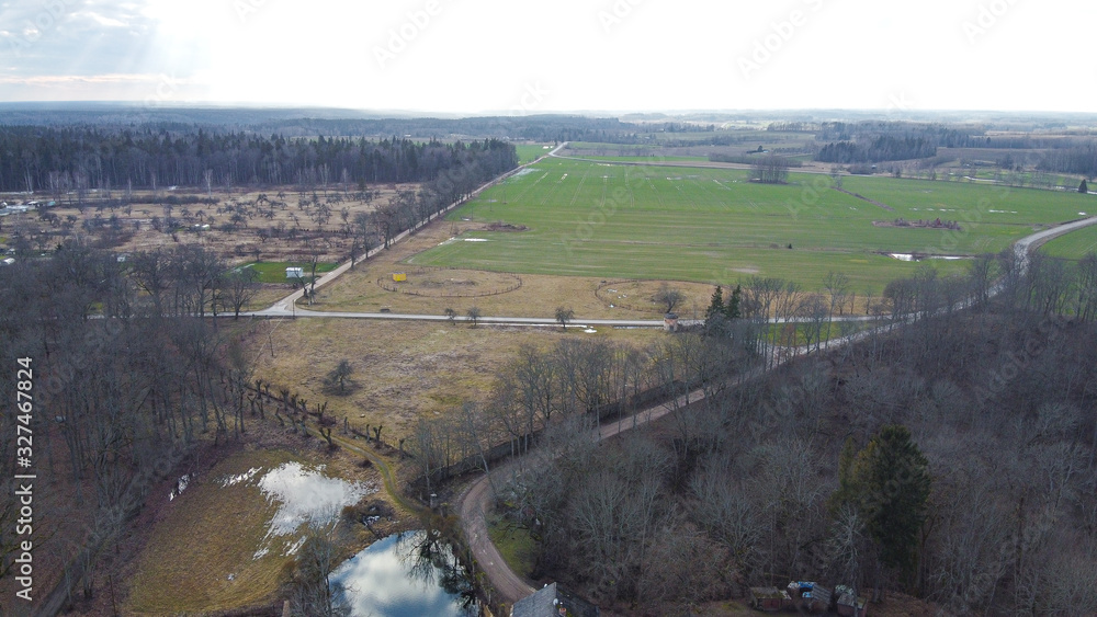 Beautiful panoramic aerial view photo from flying drone on Krimulda palace and the village in Gauja National Park near Sigulda, Latvia. (series)