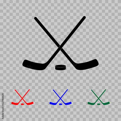 Hockey icon.  Two crossed hockey sticks and a puck. Flat. Vector