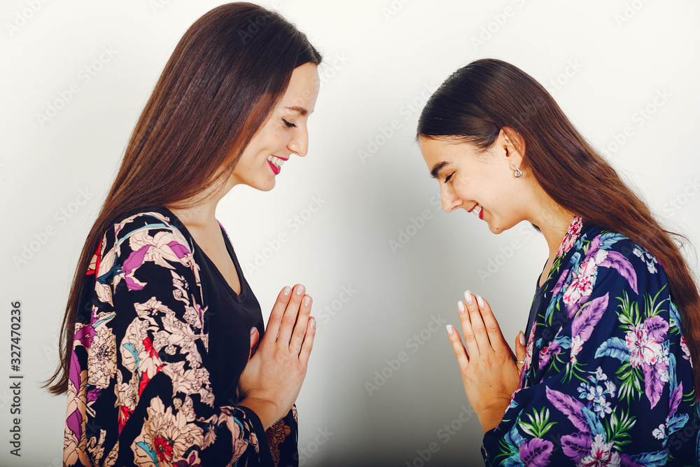 Two cute girls in a japanese costume. Ladies in a kimono Two cute girls in a japanese costume. Ladies in a kimono