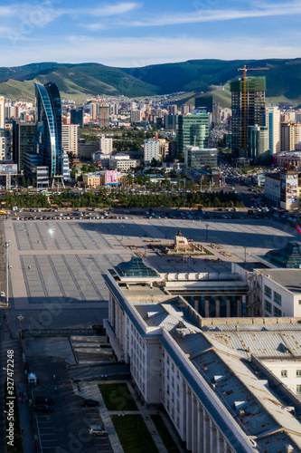 Aerial view of the Mongolian Parliament Building and the  Sukhbaatar Square, the main square of Ulaanbaatar, the capital of Mongolia, circa June 2019 photo