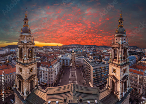 Budapest, Hungary - Amazing dramatic sunset over Budapest taken from the top of St.Stephen's Basilica. The view includes two towers of basilica, St.Stephen's Square, Buda Castle & Zrinyi street photo