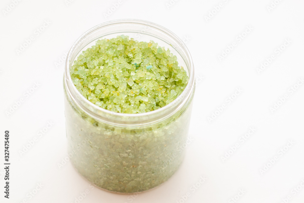 A green bath salts in a open jar. Body care cosmetic products A green bath salts in a open jar. Body care cosmetic products