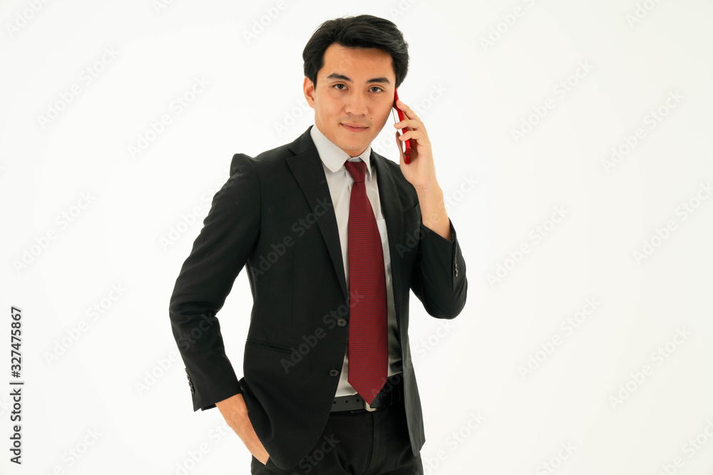 Young asian male is talking on the phone with business partner. Business concept Young asian male is talking on the phone with business partner. Business concept