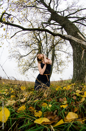 beautiful sexy girl, posing in the nature, autumn dresses photo