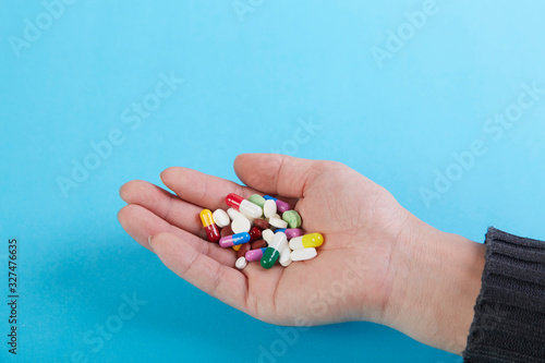 A bunch of capsules in the palm of your hand