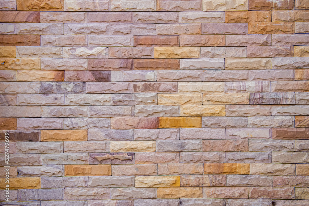 Fototapeta premium Architecture of Wall Textured and Exterior Decorative Design for Resident Housing, Granite Brik Wall Pattern Background for Home Decor. Abstract Wallpaper Texture Concept