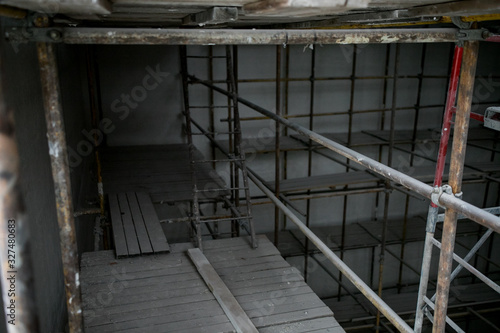 Scaffolding and wall plastering in buildings are under construction
