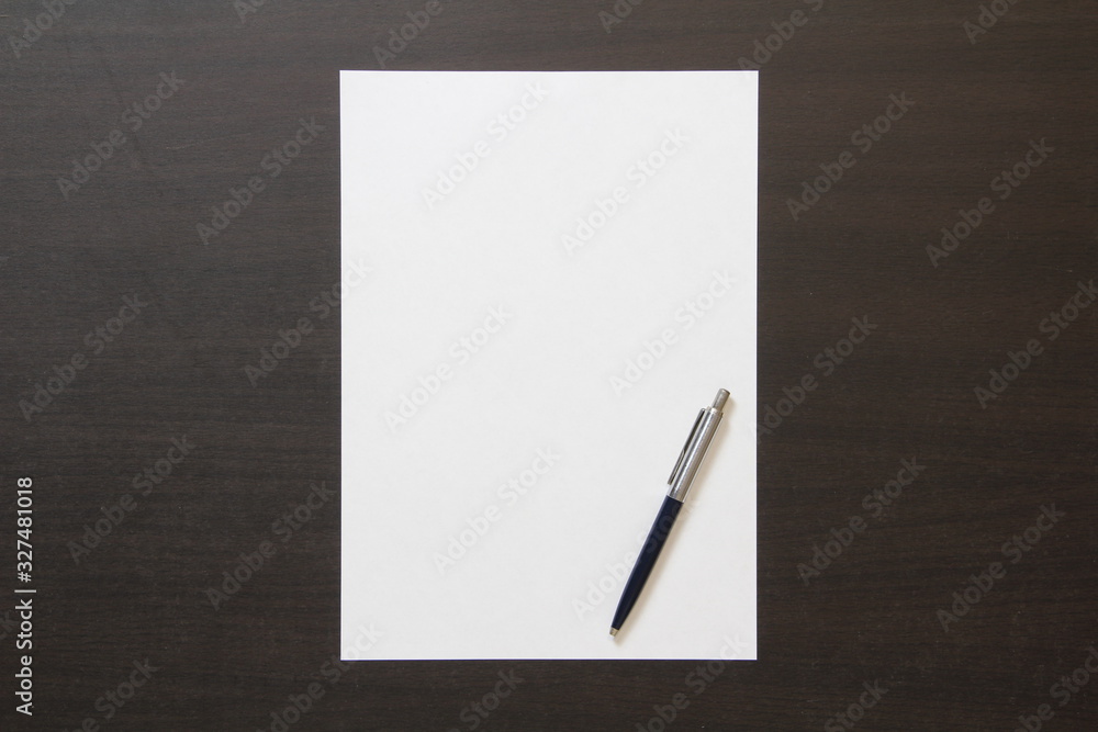Template of white paper with pen on dark wenge color wooden background. Template of white paper with pen on dark wenge color wooden background.