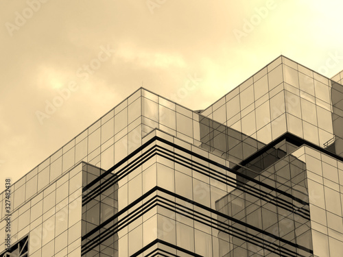 Sky reflection in the glass windows of modern office building