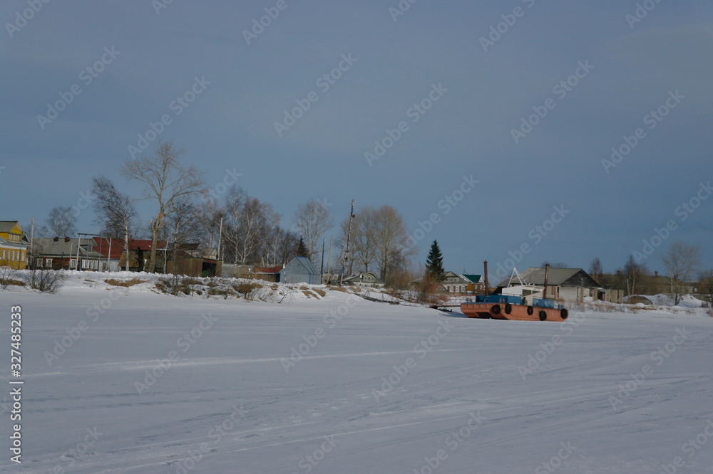 a village on an island in the Northern Dvina Delta in the winter.