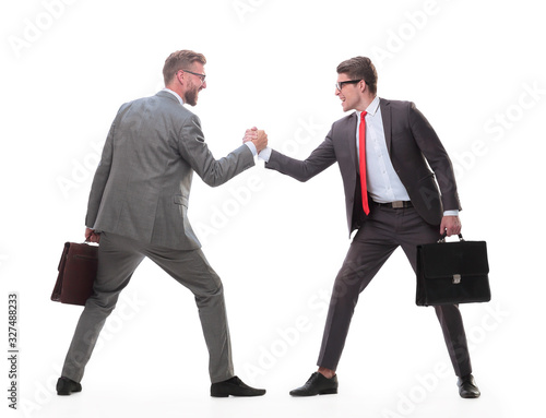 Foto side view. two business competitors showing their strength.