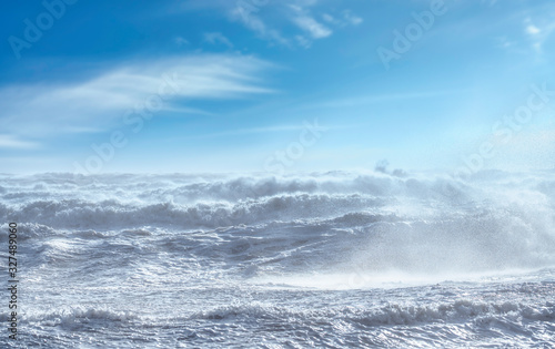 Stormy sea with waves and foam during wind storm. Tyrrhenian Sea, Tuscany, Italy.