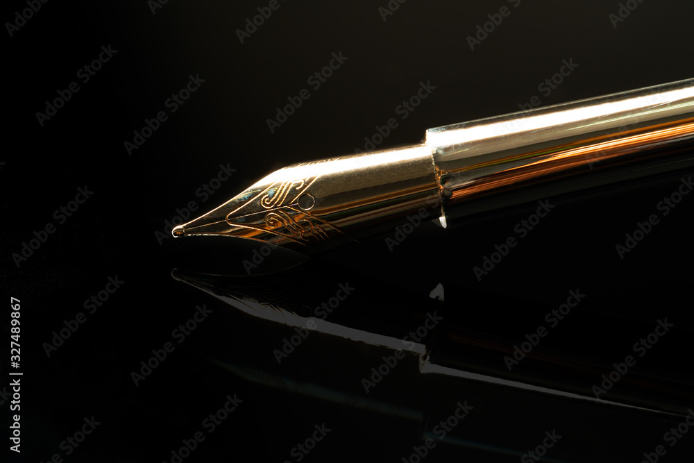Close up of a pen on black background Close up of a pen on black background