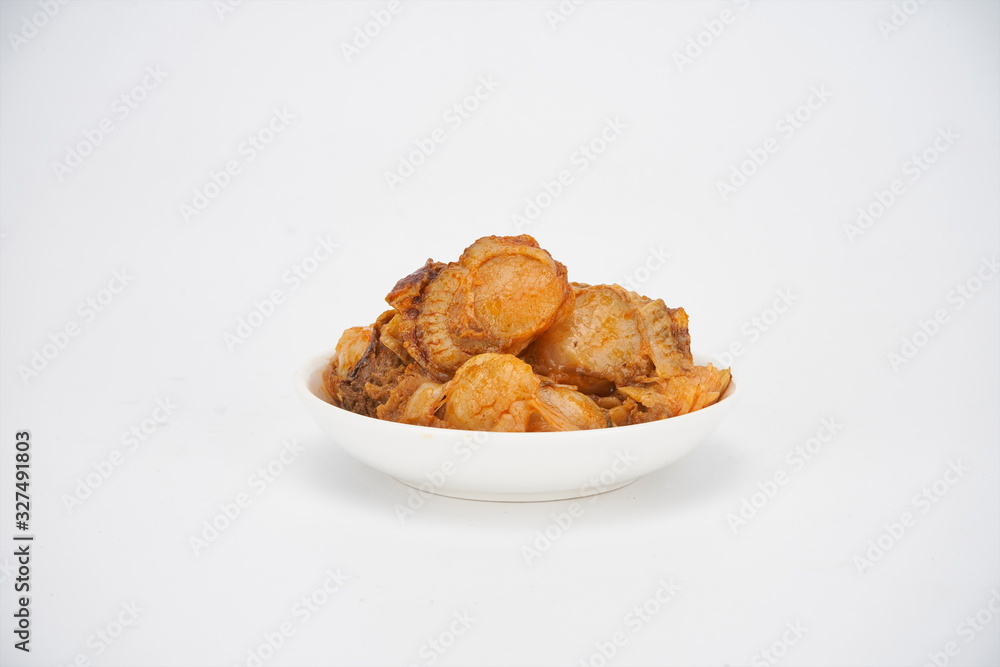 Grilled scallop with sauce and put it in the tableware Grilled scallop with sauce and put it in the tableware