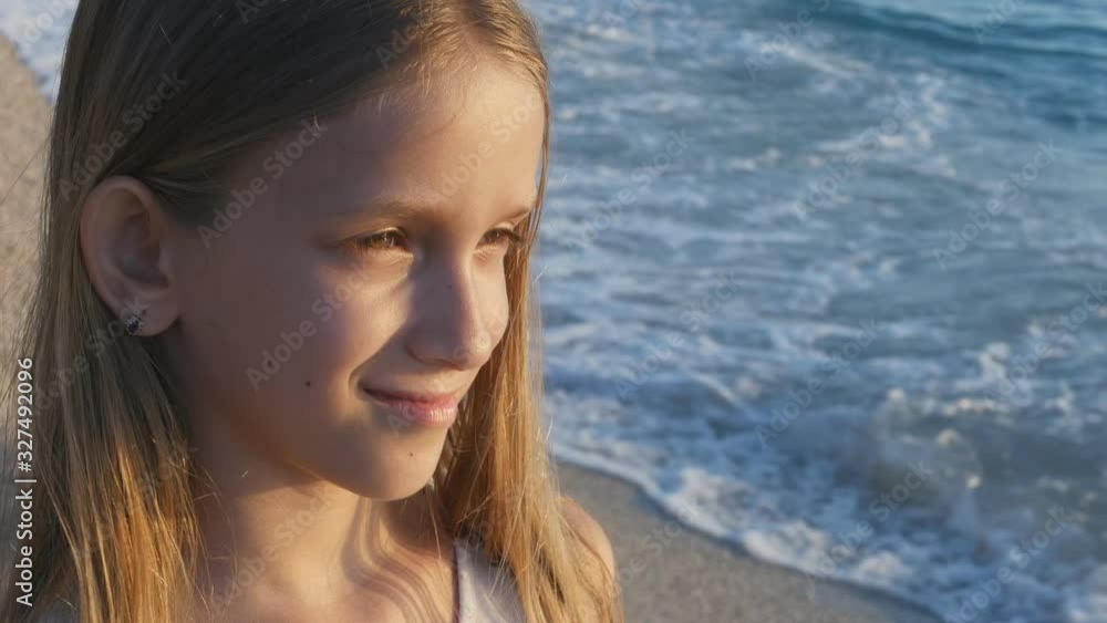 Kid Playing on Beach in Sunset, Child Watching Sea Waves, Girl Portrait on Shore Kid Playing on Beach in Sunset, Child Watching Sea Waves, Girl Portrait on Shore