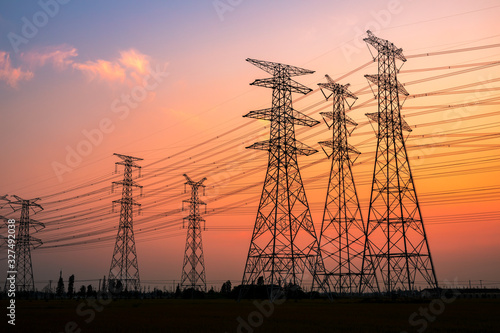 High voltage power tower and beautiful nature landscape at sunset