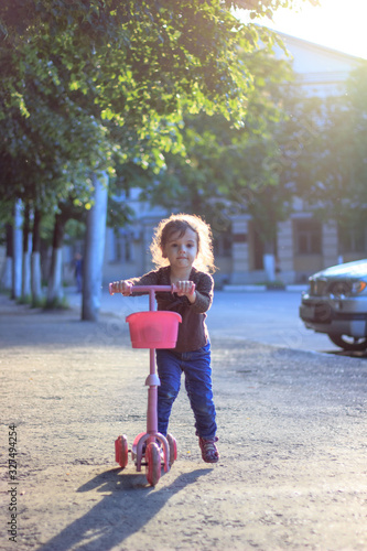 Yong kid girl ride on stree...