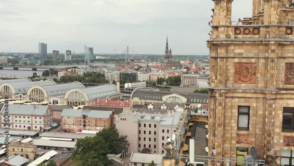 RIGA, LATVIA - MAY, 2019: Aerial view of the symbolism building of the Academy of Sciences on the background of Riga. RIGA, LATVIA - MAY, 2019: Aerial view of the symbolism building of the Academy of Sciences on the background of Riga.