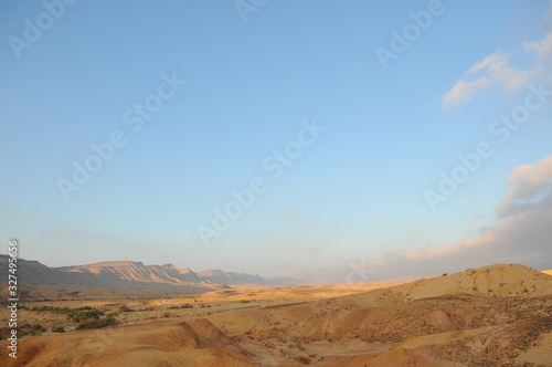 Desert landscape at sunrise. Hiking desert part of Israel National Trail. Negev desert . Valley. Colorful sands 