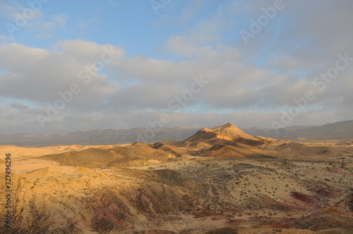 Desert landscape at sunrise. Hiking desert part of Israel National Trail. Negev desert . Valley. Colorful sands 