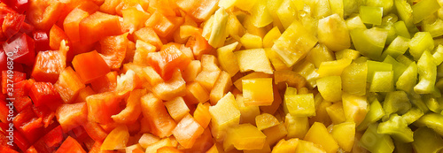 Finely chopped slices of red, yellow and green paprika closeup