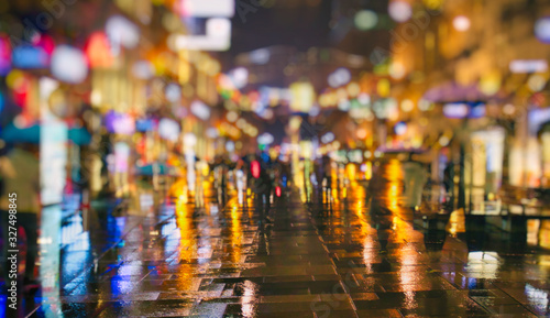 crowd of people on night street in the city