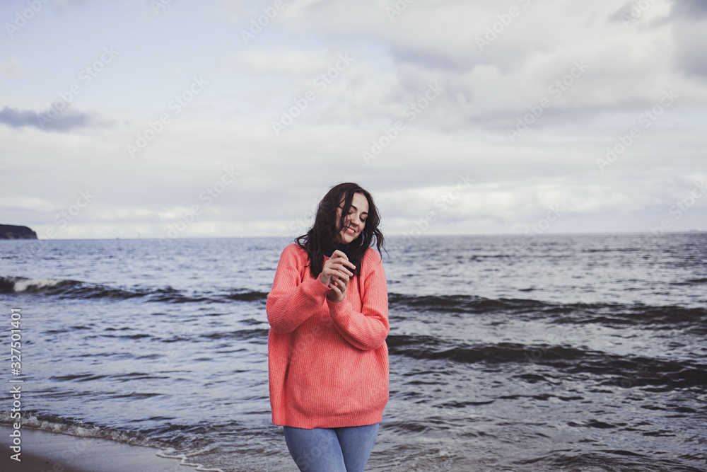 Happy woman smiling on beach in autumn weekend. Happy woman smiling on beach in autumn weekend.