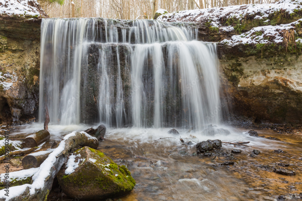 Obraz premium City Sigulda, Latvia. Waterfall in winter. White snow and trees. Travel photo.