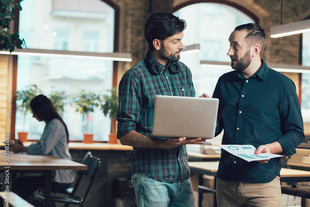 Two man in the office having interesting conversation stock photo Two man in the office having interesting conversation stock photo